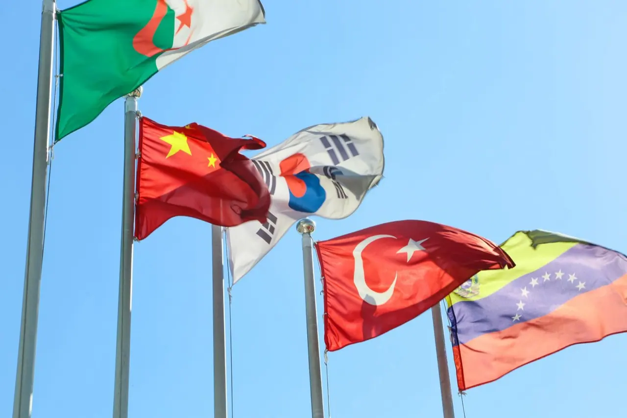 A row of flags on poles